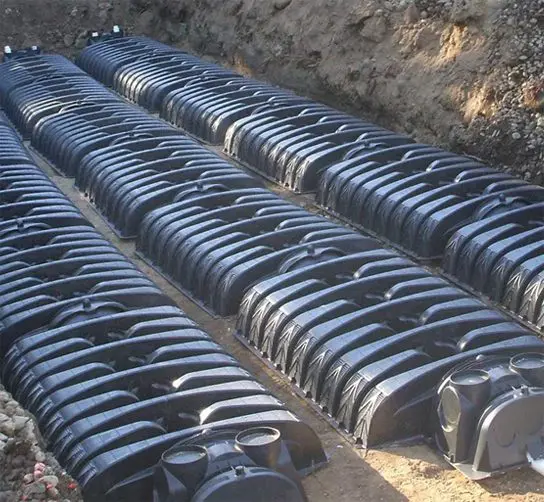 A bunch of pipes that are in the dirt.